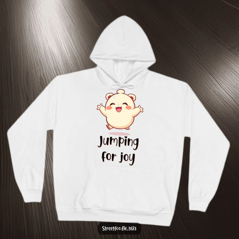 Funny hoodie featuring a smiling dumpling character joyfully leaping, providing warmth and a dose of cartoonish delight.