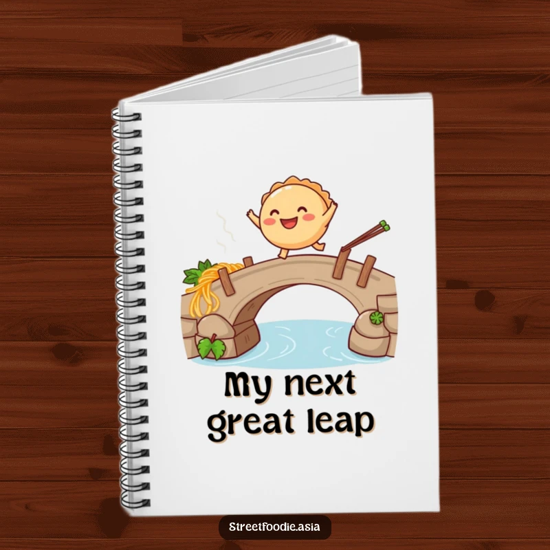 Funny notebook with a smiling empanada leaping over a steaming noodle bridge, perfect for jotting down humorous notes.