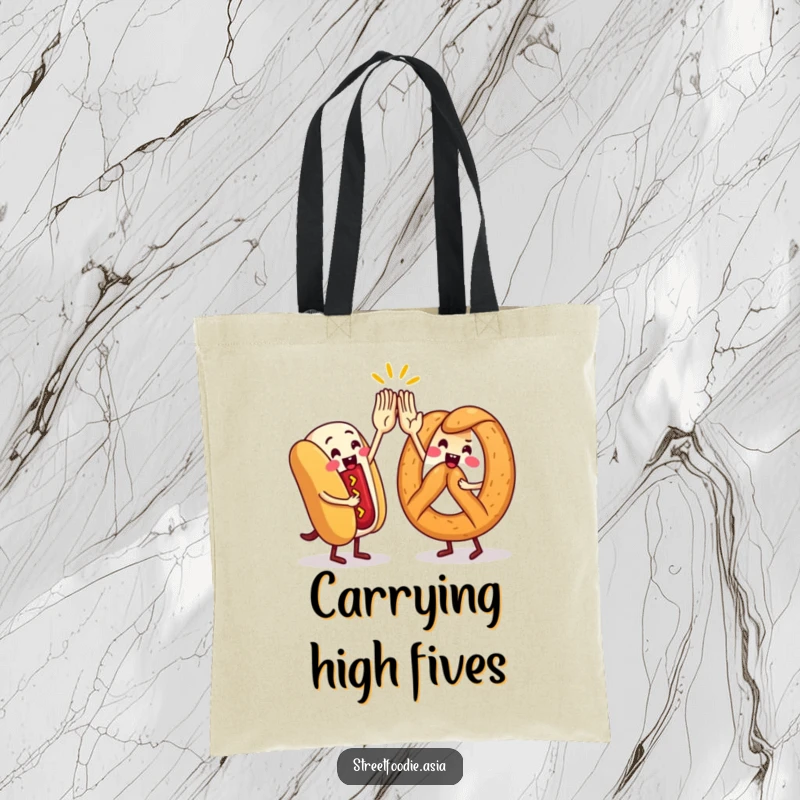 Funny Tote Bag showing a hot dog and pretzel character in a high-five, ideal for carrying items with a dose of foodie fun.
